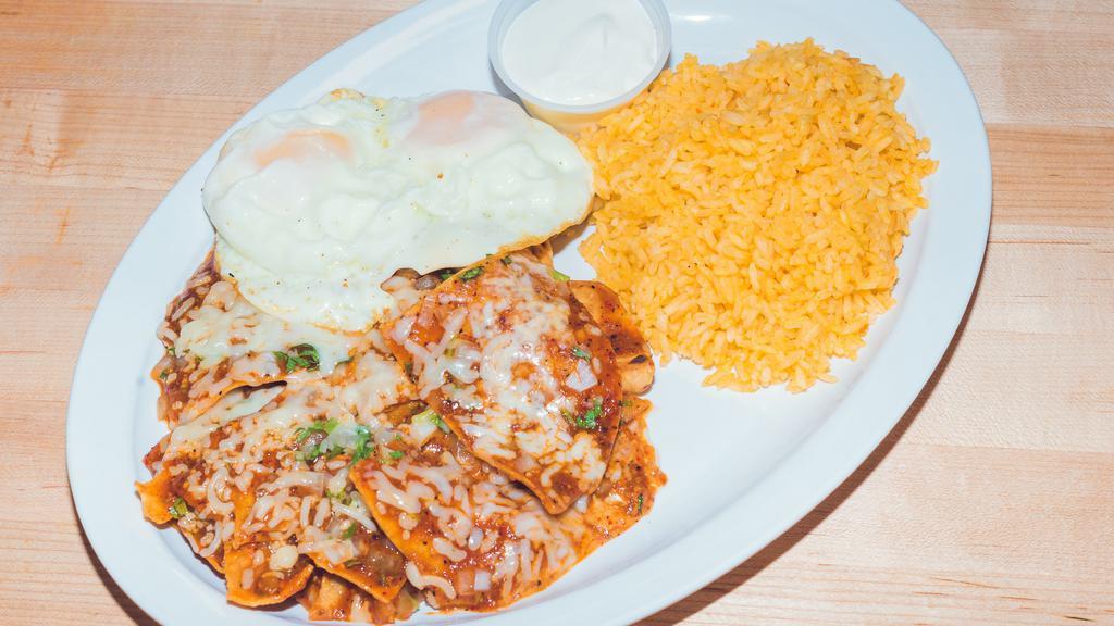 Chilaquiles · Red or green salsa, with rice sour cream and three eggs al gusto.