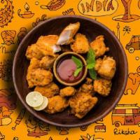 Chicken Pakora Passion · Mildly spiced morsels of chicken batter fried till crisp and golden
