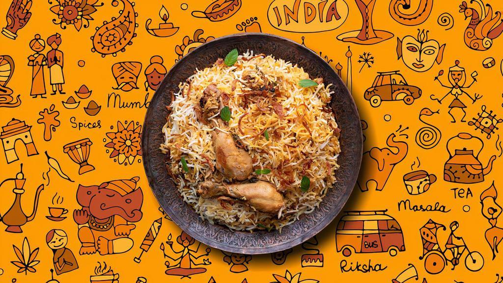 Chicken Biryani · Our long grain basmati rice cooked with chicken marinated in yogurt and house spices in our special biryani masala gravy, served with a side of yogurt raita