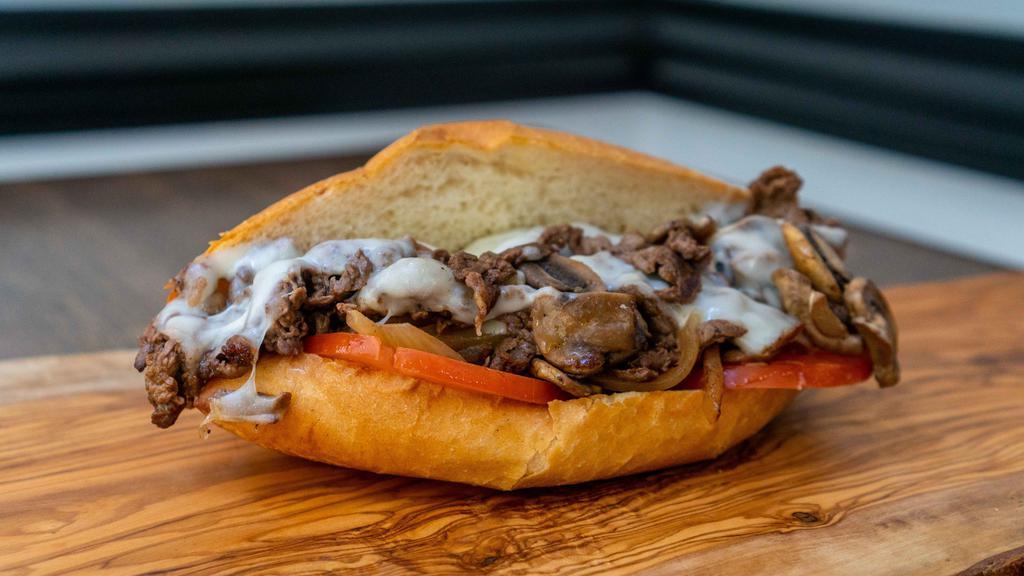 Ziggy's Cheesesteak Sandwich · Thinly sliced halal rib eye steak, grilled onions, sautéed mushrooms, tomato and melted provolone cheese (add jalapeños or hot sauce free).