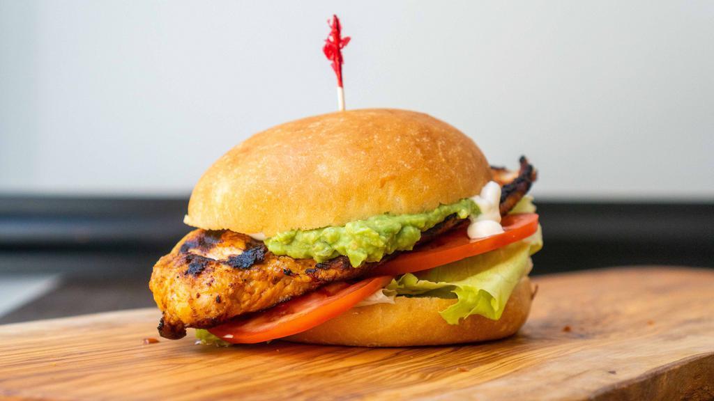 California  Chicken · Grilled halal marinated chicken breast, topped with melted cheese, avocado, onion, pickles,, lettuce, tomato and mayo on a egg bun.