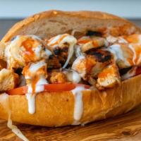 Buffalo Chicken Cheesesteak Sandwich · Grilled all natural halal chicken marinated in buffalo wing sauce, with grilled onions, saut...