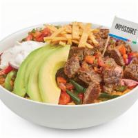 Impossible™ Bowl · Baja rice topped with roasted veggies, delicious Impossible meat made from plants, sour crea...