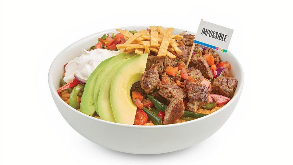 Impossible™ Bowl · Baja rice topped with roasted veggies, delicious Impossible meat made from plants, sour cream, avocado, Pico de Gallo and tortilla strips.