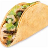 Baja Taco · Your choice of protein on corn tortillas with hot or mild salsa and onion & cilantro mix.