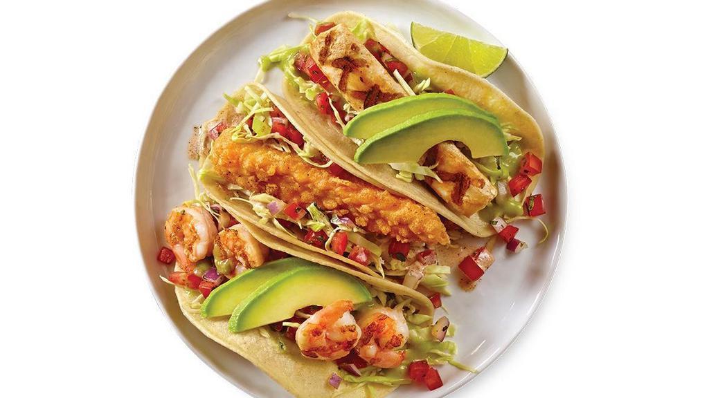 Seafood Tacos · Grilled Seafood: topped with sliced fresh avocado, shredded cabbage, avocado salsa, & pico de gallo.. Crispy Wahoo: topped with cabbage, pico de gallo, & tangy salsa.