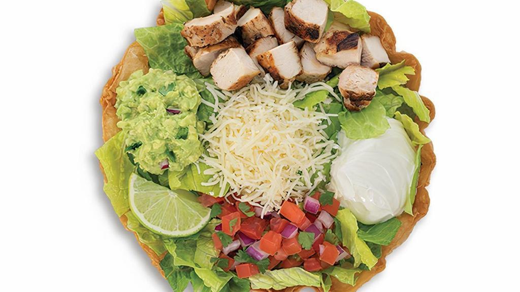 Tostada · Choice of chicken, steak, or shrimp in a crispy flour tortilla shell filled with romaine lettuce, choice of black or pinto beans, fresh hand-made guacamole, jack cheese, freshly made pico de gallo and sour cream.