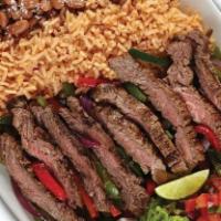 Fajitas · Grilled meat or seafood, roasted veggies, Baja rice, choice of black or pinto beans, sour cr...