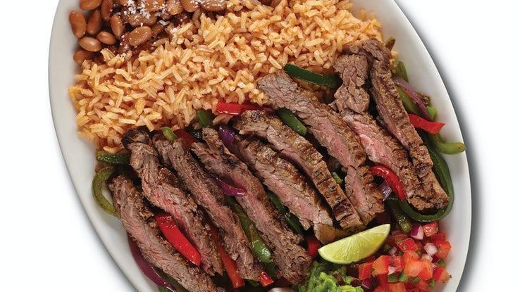 Fajitas · Grilled meat or seafood, roasted veggies, Baja rice, choice of black or pinto beans, sour cream, guacamole, and pico de gallo with warm corn or flour tortillas.