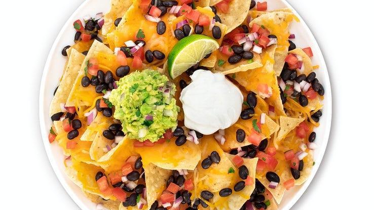 Nachos · Your choice of protein with chips, cheese, black or pinto beans, guacamole, pico de gallo and sour cream