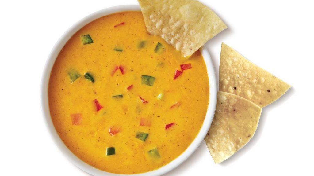 Queso (8Oz)  And Chips · 8 oz of spicy three pepper cheese dip. Served warm with freshly made tortilla chips.