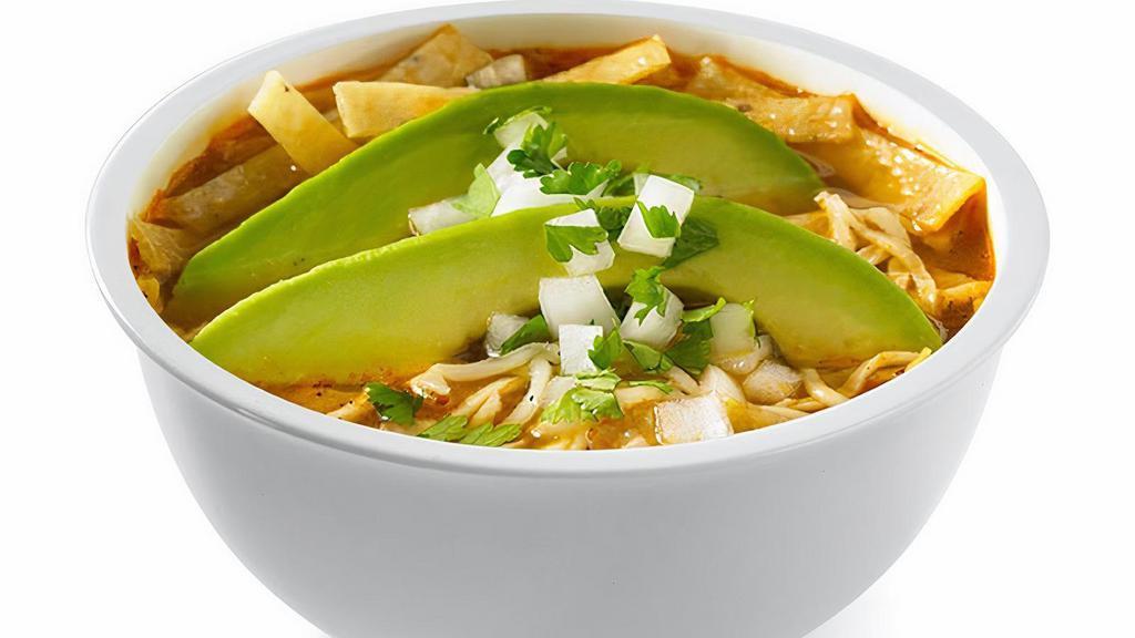 Chicken Tortilla Soup · Roasted tomato and tortilla soup with fire-grilled all white meat chicken, topped with fresh sliced avocado, Jack cheese, fresh onions, cilantro & tortilla strips.