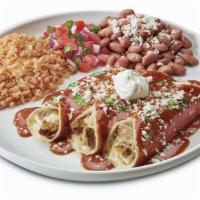 Enchiladas Rojas · Corn tortillas rolled with chicken and jack cheese, topped with enchilada salsa, cojita chee...