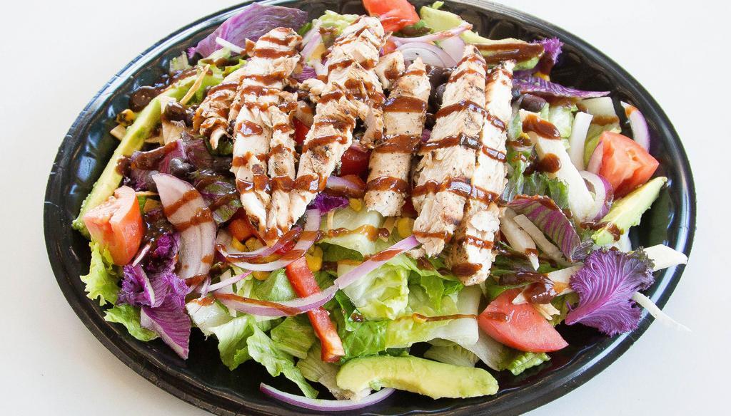 Baja Bbq Chicken Salad · Hand tossed fresh salad greens and kale, onion, bell pepper, jicama and tortilla strips, roasted corn, black beans, tomatoes and avocado tossed with Baja bbq dressing.