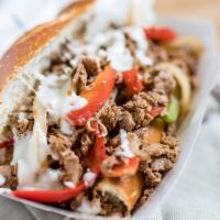 Philly Cheesesteak · Grass-fed sirloin, bell peppers, mozzarella, on a French roll.
