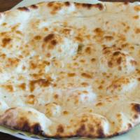 25. Plain Naan · Classic flat bread baked in tandoor.