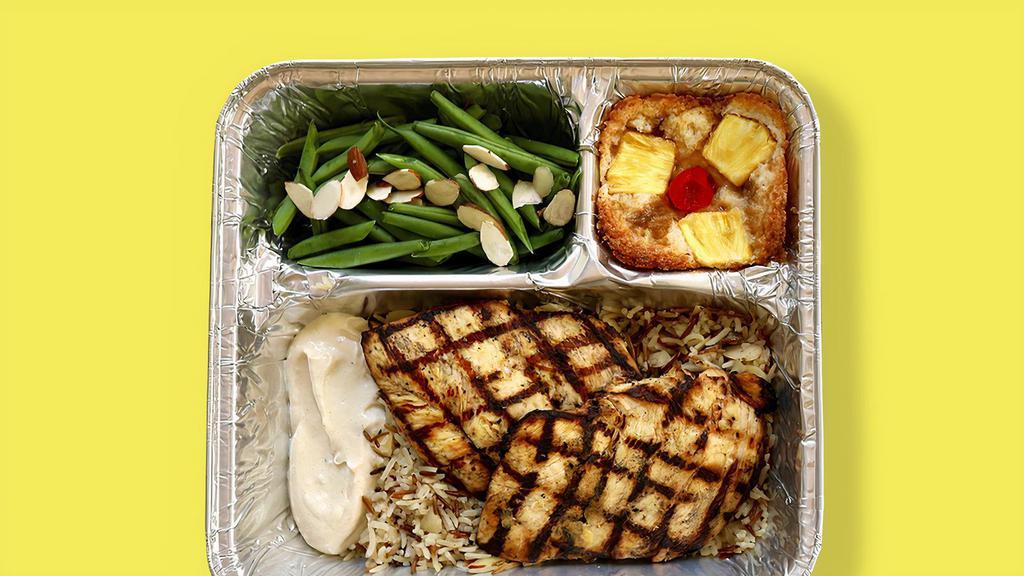 Tv Dinner Grilled Lemon Chicken · Hearty meals made in-house, frozen in retro-style trays, and ready to pop in the oven when you need them. Marinated + grilled boneless chicken breasts and housemade citrus cream sauce served with red lake nation wild rice and garlic butter green beans + almonds, with a pineapple upside down cake dessert