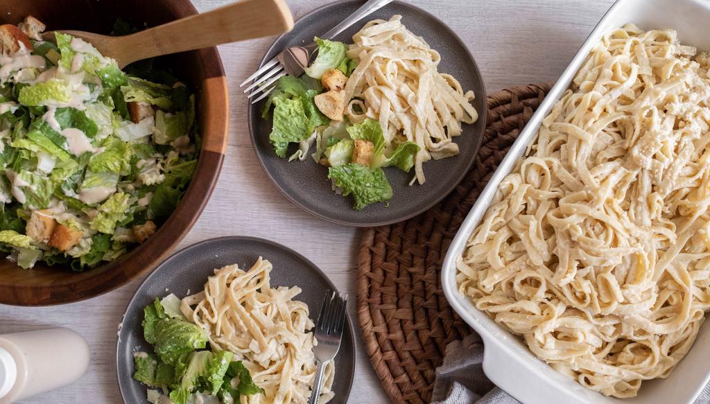 Fettuccine Alfredo W/ Chicken Meal · Fettuccine noodles, parmesan chardonnay cream sauce, romano cheese // family-style caesar salad with our housemade dressing, garlic croutons + parmesan