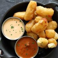 Cheddar Cheese Curds · ellsworth cooperative creamery's all-natural white cheddar curds served with slow-cooked mar...