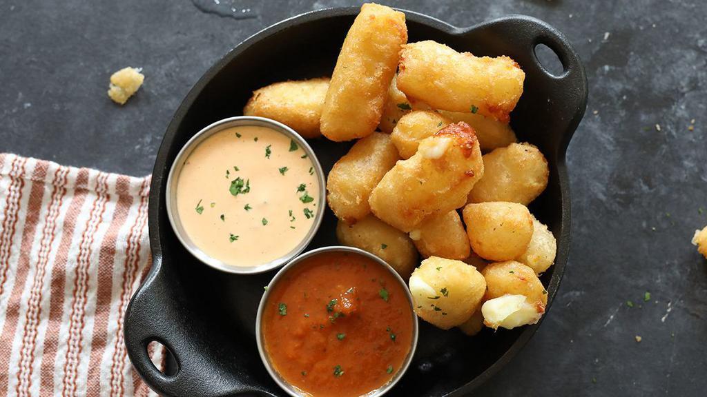 Cheddar Cheese Curds · ellsworth cooperative creamery's all-natural white cheddar curds served with slow-cooked marinara sauce and housemade nashville hot ranch for dipping [770 cal]