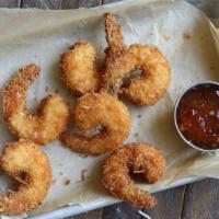 Jumbo Coconut Shrimp · hand-breaded and fried to order, served with peanut-sesame slaw + sweet and spicy sauce for ...