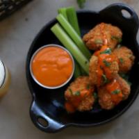 Buffalo Chicken Nuggets · hand-breaded chicken nuggets tossed in cajun spices, drizzled with high altitude hot sauce, ...