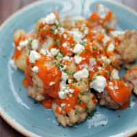 Buffalo Cauliflower · high altitude hot sauce, blue cheese, parsley, served with a side of ranch [930 cal] .