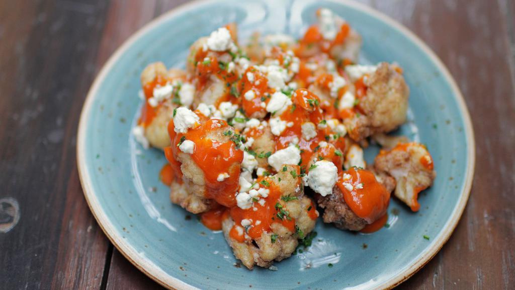 Buffalo Cauliflower · high altitude hot sauce, blue cheese, parsley, served with a side of ranch [930 cal] .
