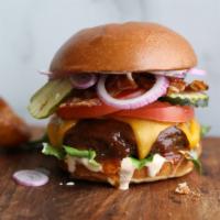 Bbq Ranch Bacon Burger* · grilled half-pound beef patty, smoked bacon, cheddar, chipotle ranch, lettuce, tomato, pickl...