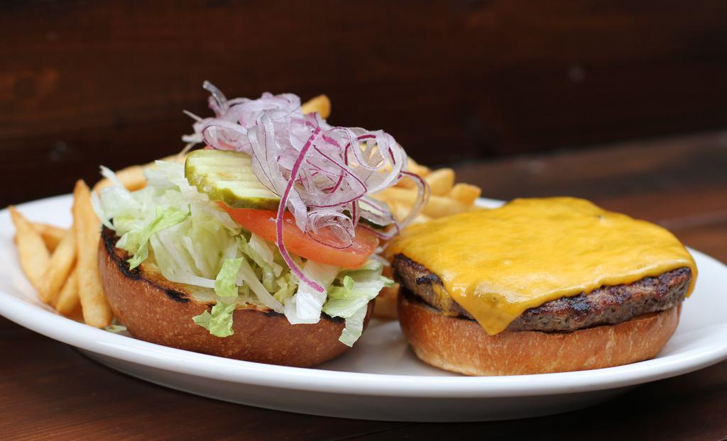 Cheeseburger* · grilled half-pound beef patty, choice of cheese, lettuce, tomato, pickle, red onion [700 cal] .