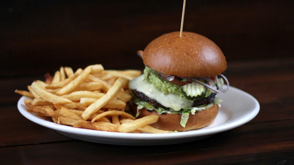 Baja California Burger* · grilled half-pound beef patty, guacamole, hatch chiles, jack, roasted jalapeño-lime aioli, lettuce, tomato, pickle, red onion [970 cal] .