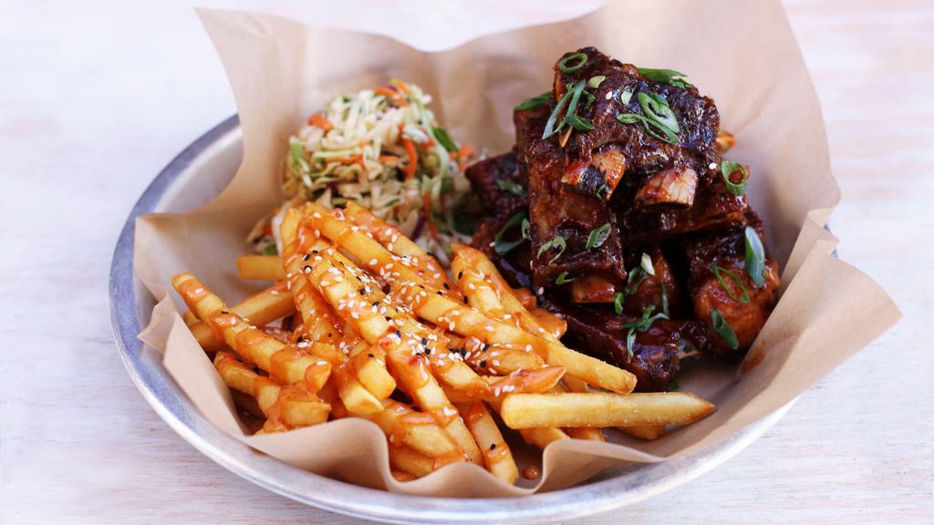 Sticky Ribs & Umami Fries · tender st. louis style ribs, flash-fried until crispy, brushed with honey plum sauce, served with peanut sesame slaw [2200/3140 cal]