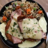 Creamy Dijon Chicken · hand-breaded chicken breasts, topped with shaved beeler’s ranch smoked ham, melted swiss che...
