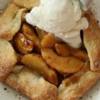 Apple-Huckleberry Open Face Pie · wild huckleberries, cinnamon apples, salted caramel sauce, served warm with a scoop of vanil...
