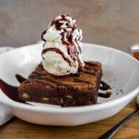 Chocolate Brownie Sundae · our housemade white chocolate chip brownie served with a side of chocolate syrup + vanilla b...