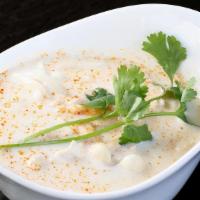Tom Kha Soup · Coconut soup with lemongrass, lime juice, galangal, kaffir lime leaf and white beech mushroom.