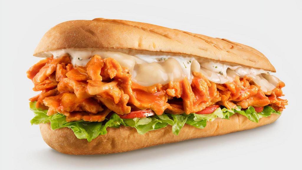 Chicken Buffalo · Who says a sandwich can’t bring the heat? Our Chicken Buffalo cheesesteak features USDA-choice grilled chicken infused with spicy buffalo sauce and topped with smooth, melted provolone cheese. All served on our signature toasted roll. We recommend adding some ranch dressing to this buffalo chicken cheesesteak if you want to bring down the spice. . All cheesesteaks come with optional creamy mayonnaise, juicy tomato, shredded lettuce, and crispy pickle. . The Chicken Buffalo Cheesesteak pairs perfectly with Original French Fries or a Real-Fruit Peach Lemonade..