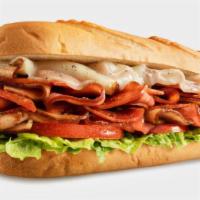 Italian Deluxe · The Italian Deluxe comes loaded with sliced meats including turkey, ham, and spiced pepperon...