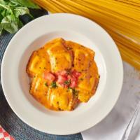 Cheese Ravioli · Tossed in our tomato cream sauce.