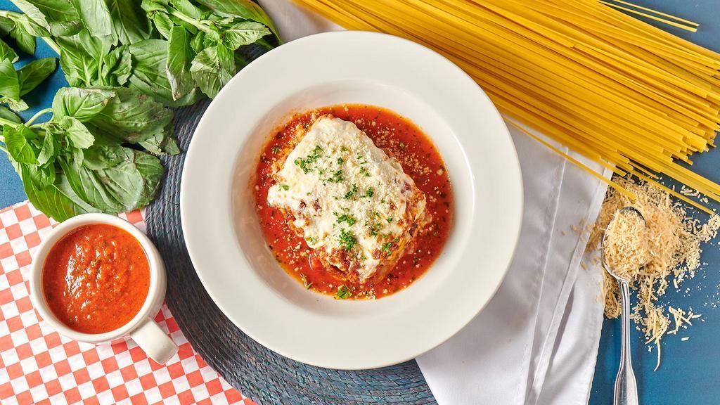Oven Baked Lasagna · Ricotta and mozzarella with our rich meat sauce.