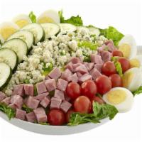 Cobb Salad · A delightful mix of blue cheese crumbles, ham, cherry tomatoes, cucumbers, and hard-boiled e...