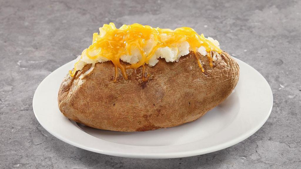 Baked Potato · Baked Potato topped with sour cream, cheese and margarine.