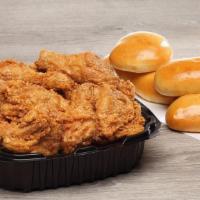 12 Piece Family Box · 12 pieces of white and dark meat paired with six fluffy yeast rolls.