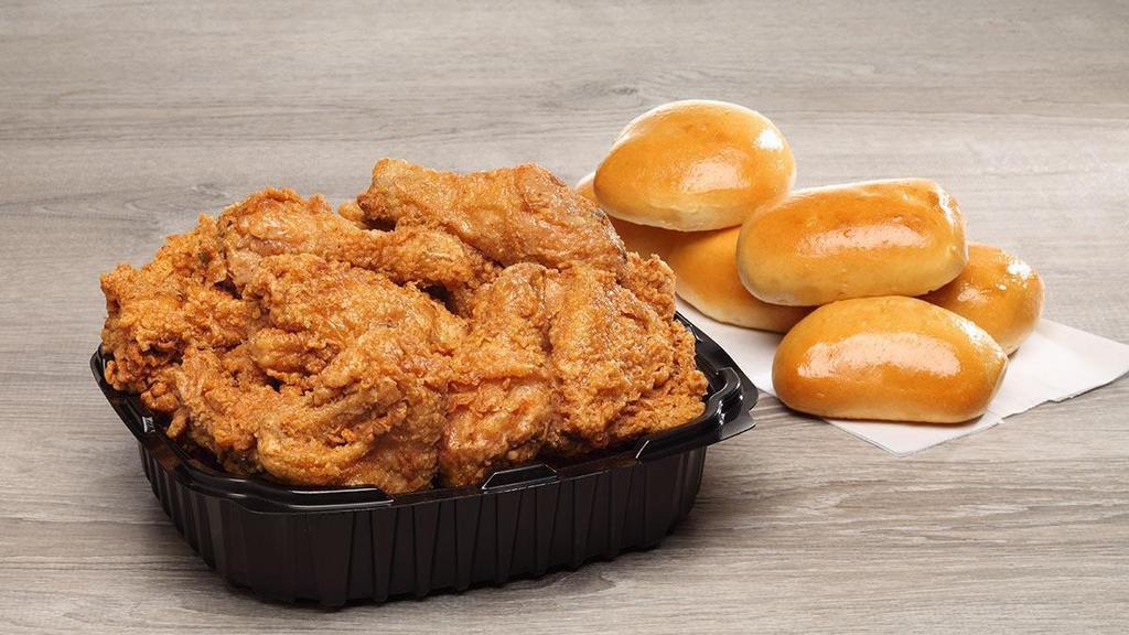12 Piece Family Box · 12 pieces of white and dark meat paired with six fluffy yeast rolls.