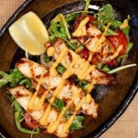 D Polpo Alla Griglia · Grilled Mediterranean Octopus served with arugula, cherry tomato, red onion, with anchovies ...
