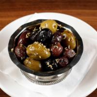 Olives Plate · Assorted Mediterranean olives with herbs and lemon zest