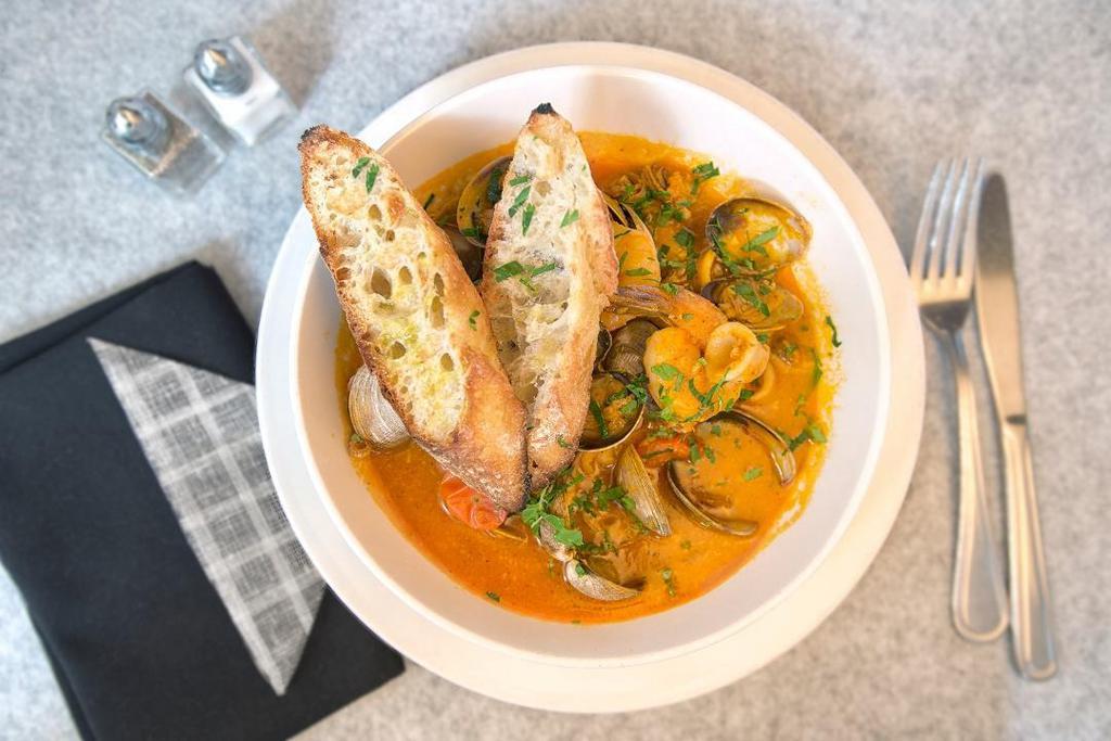 Zuppa di Pesce · Seafood Stew, Clams, Calamari, Shrimp, fresh fish in a light spicy tomato broth, Served with crostini