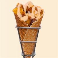 Chick’nCone · Air Fried Crispy Chicken tossed with your favorite sauce and served in a hand-rolled waffle ...