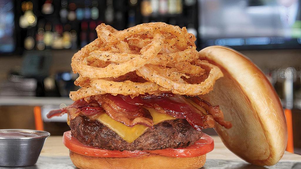 Bacon BBQ · all-natural beef* • tillamook cheddar • applewood smoked bacon • tomatoes • fried onion strings • hickory bbq • brioche bun