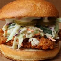 Nashy Boy · Nashville flavored chicken sandwich topped with pickles & our house ranch slaw on a brioche ...